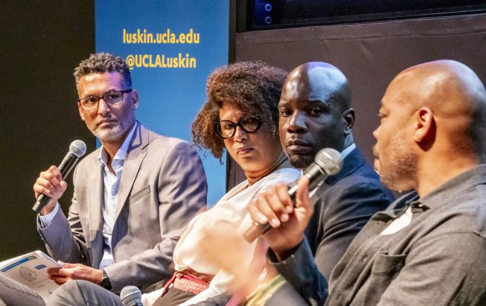 UCLA Luskin scholar Michael Lens, left, moderates a dialogue with Malika Billingslea, Malcolm Johnson and Devean George. Photos by Les Dunseith
